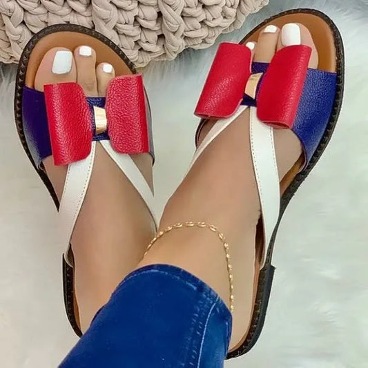 Flache Damen-Sandalen mit Schleife und gemischten Farben 